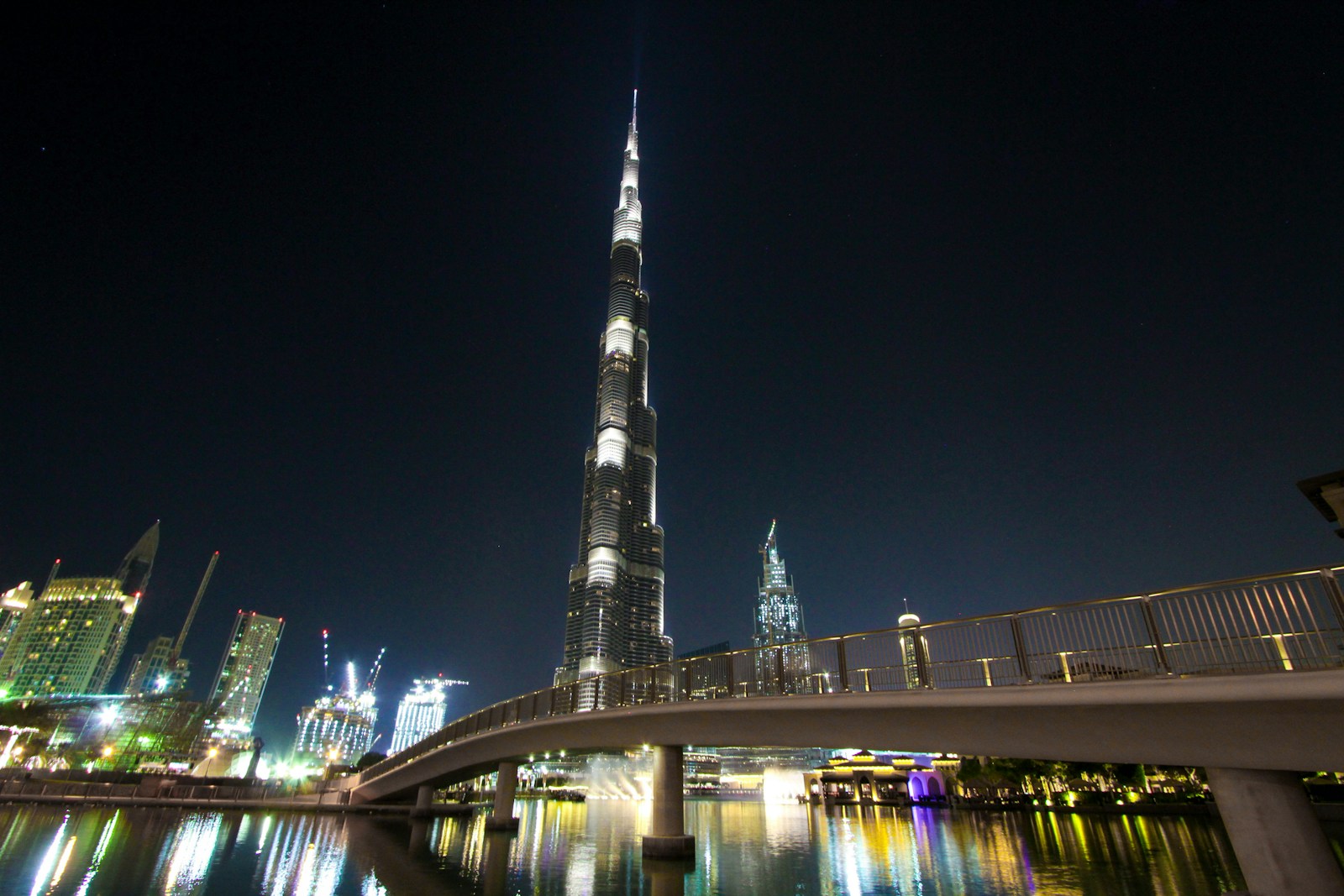 Bridge and skyline at night — Asia and the Middle East, connected